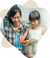 Woman and young girl gardening in soil